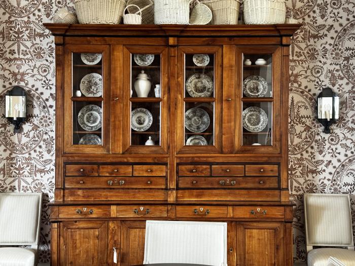 Toile dining room behind an antique hutch
