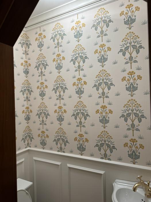Floral stripe above white wainscoting