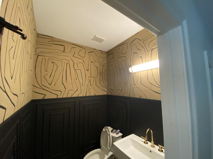 Gold and black abstract powder room